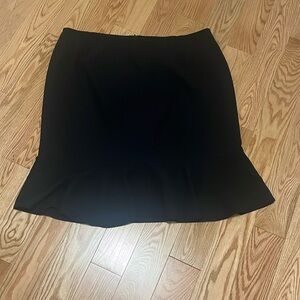 Black skirt with ruffle detail at the bottomm.  Great condition and size 24.
